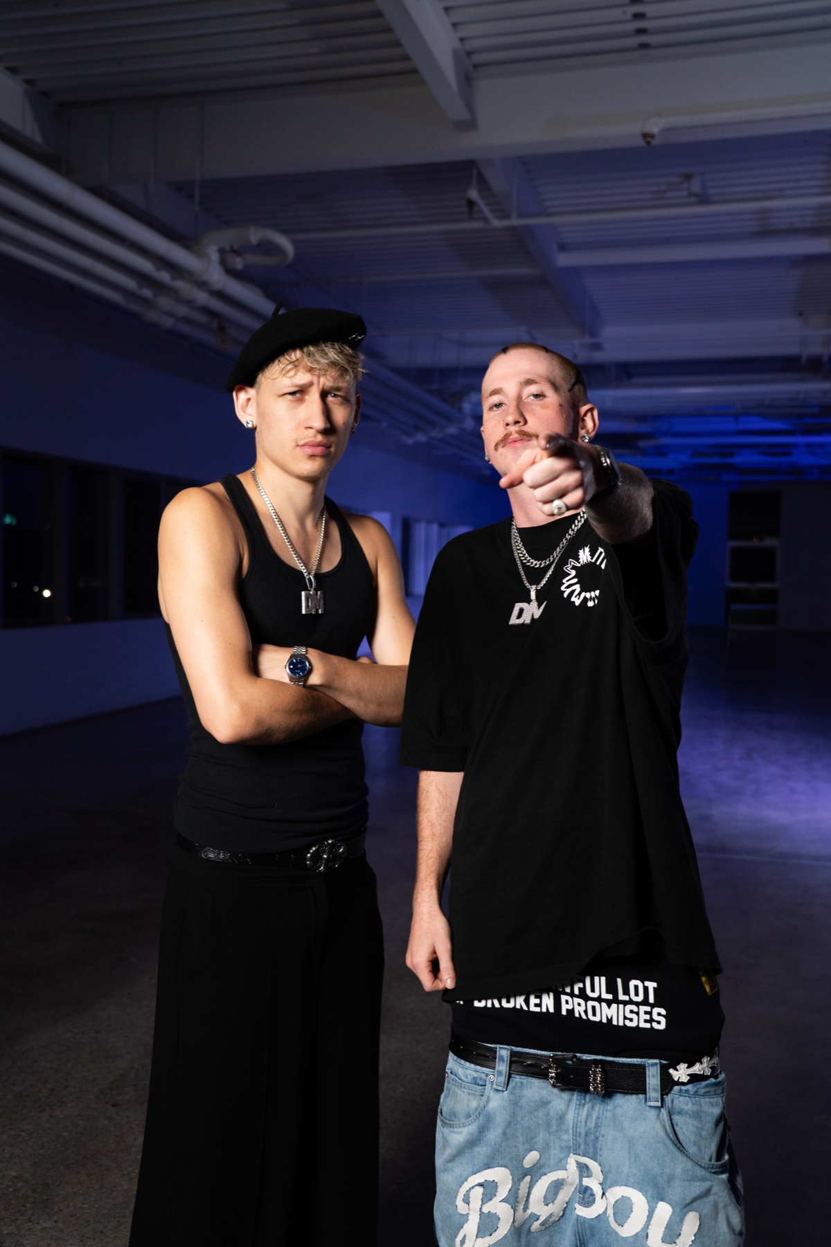 Two DMTV team members in a blue-lit Toronto space.