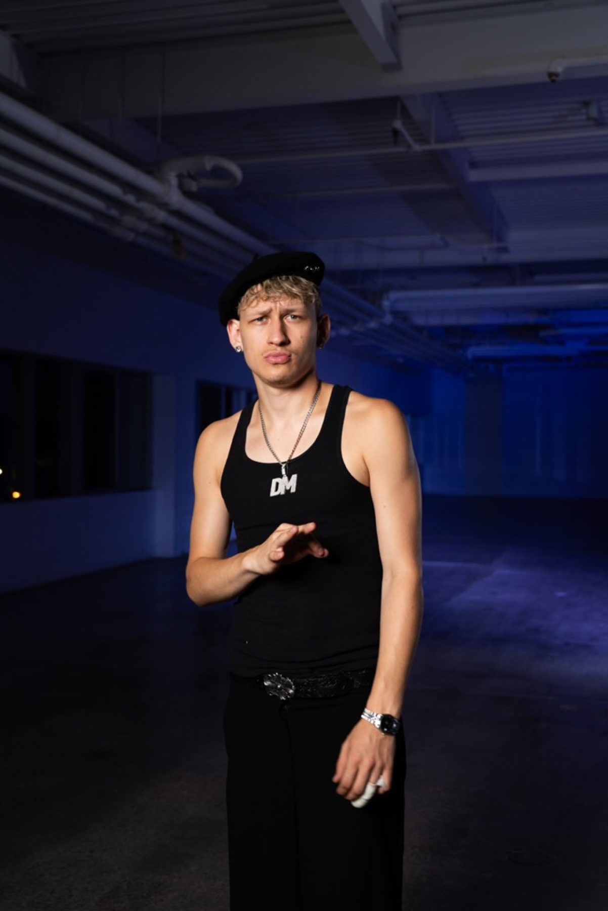 DMTV team member in a blue-lit Toronto space.